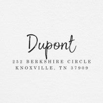 The impression made from the Dupont Brush Return Address Stamp on grey paper