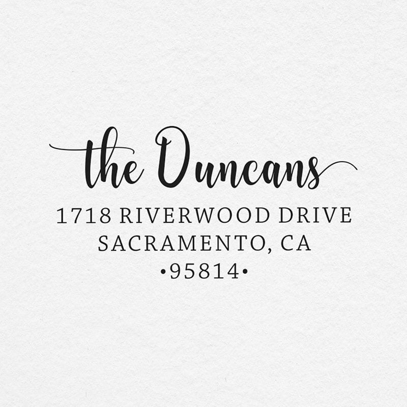 The impression of the Duncan Script Address Stamp on grey paper