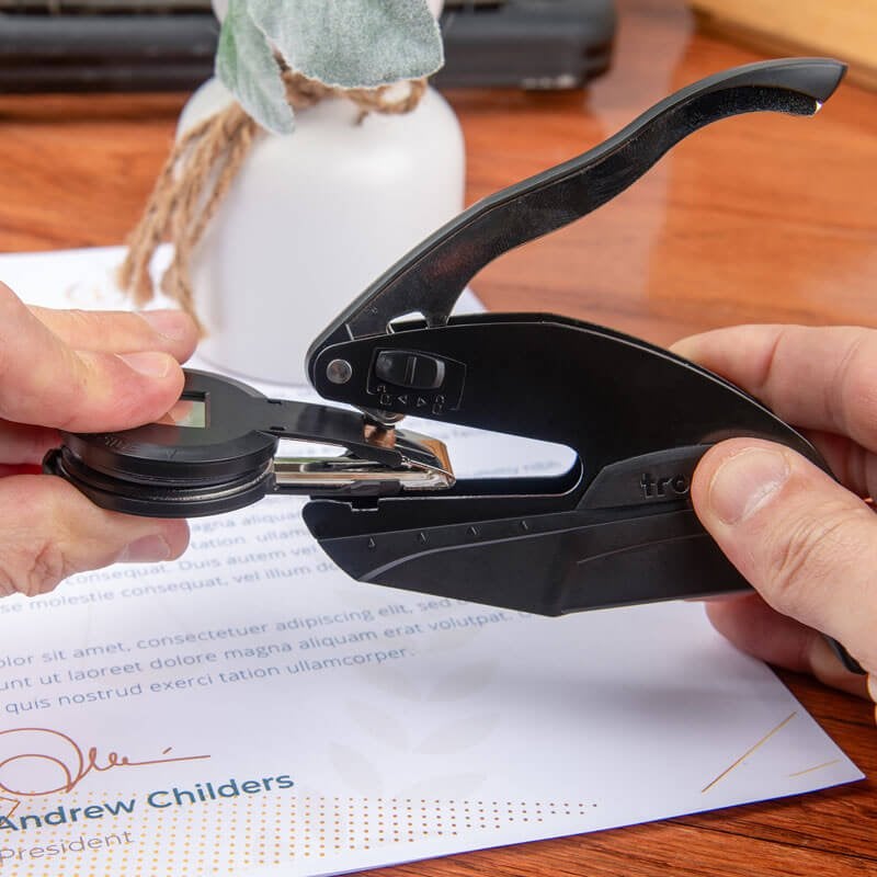 Embossing stamp body with book stamp being inserted