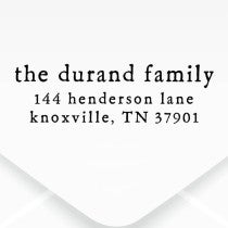 The impression made from the Dupont Brush Return Address Stamp on grey paper
