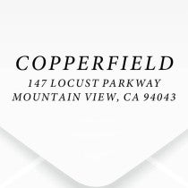 The impression made from the Dupont Brush Return Address Stamp on grey paper