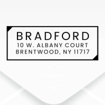 The impression made from the Dupont Brush Return Address Stamp on grey paper
