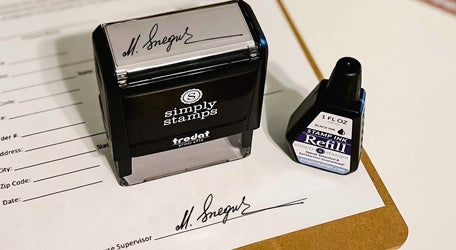 custom signature stamp with ink bottle