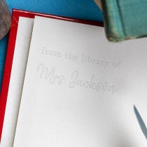 Example of Rustic Serif From the Library of Embosser impression in book