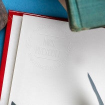 Example of Round Branch Read It Love It Return It book embosser impression on Book