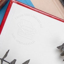 View of library book embosser impression inside book