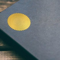 Personalized Book Embosser Impression on Seal Sticker on Blue Book