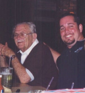 Mr.Holmes on the left and Bryan Croft on the right sitting at a dinner table