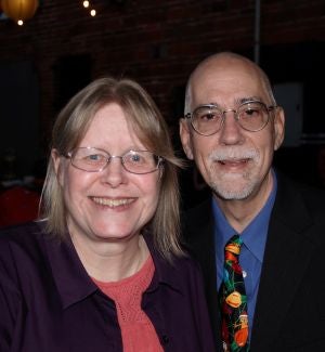 Mick and Kelly dressed nicely smiling for the camera