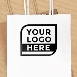 close up of a square logo stamp impression on a brown paper bag